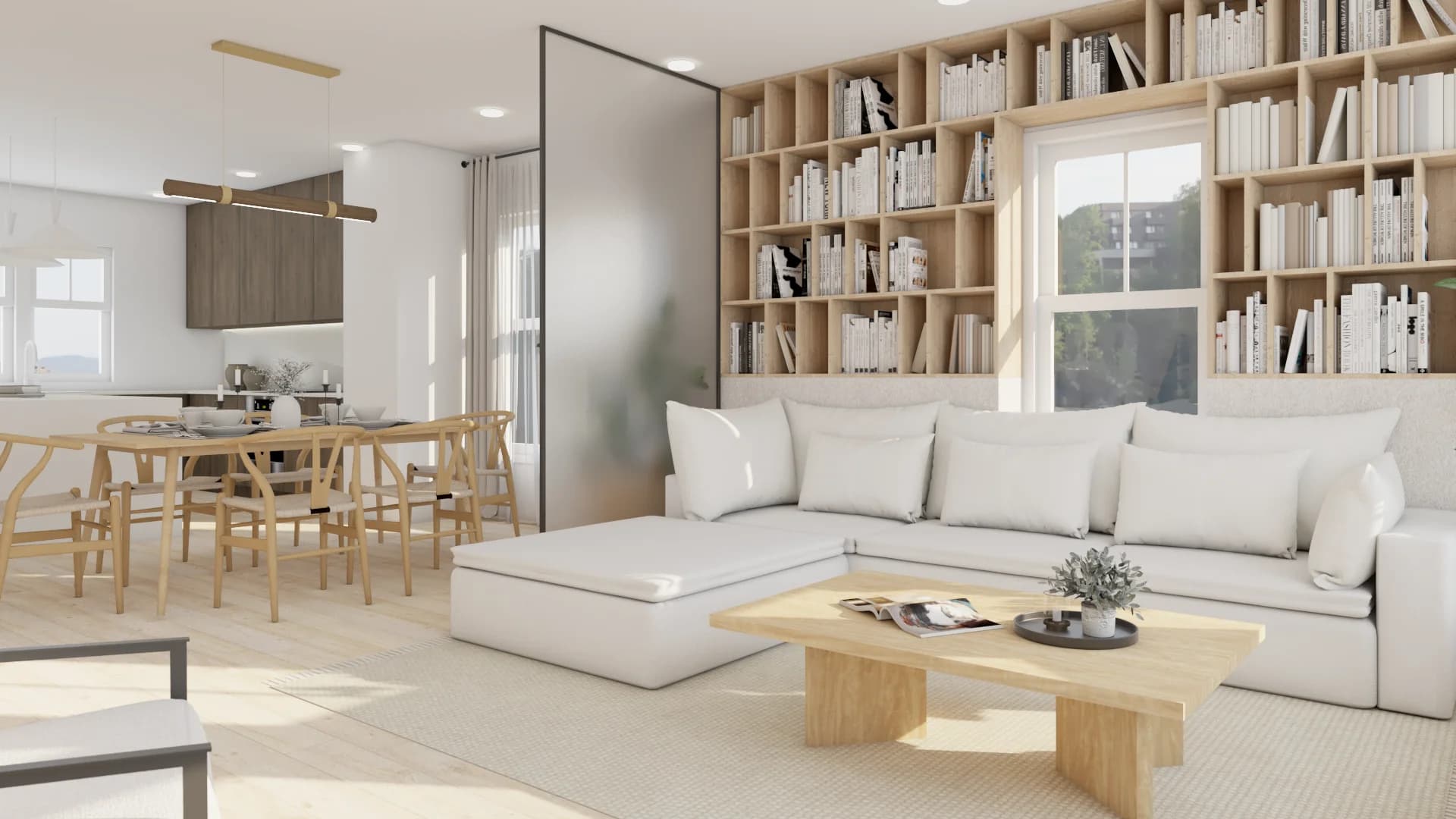 White sectional facing floor-to-ceiling oak bookshelf, oak dining table with wishbone chairs visible behind