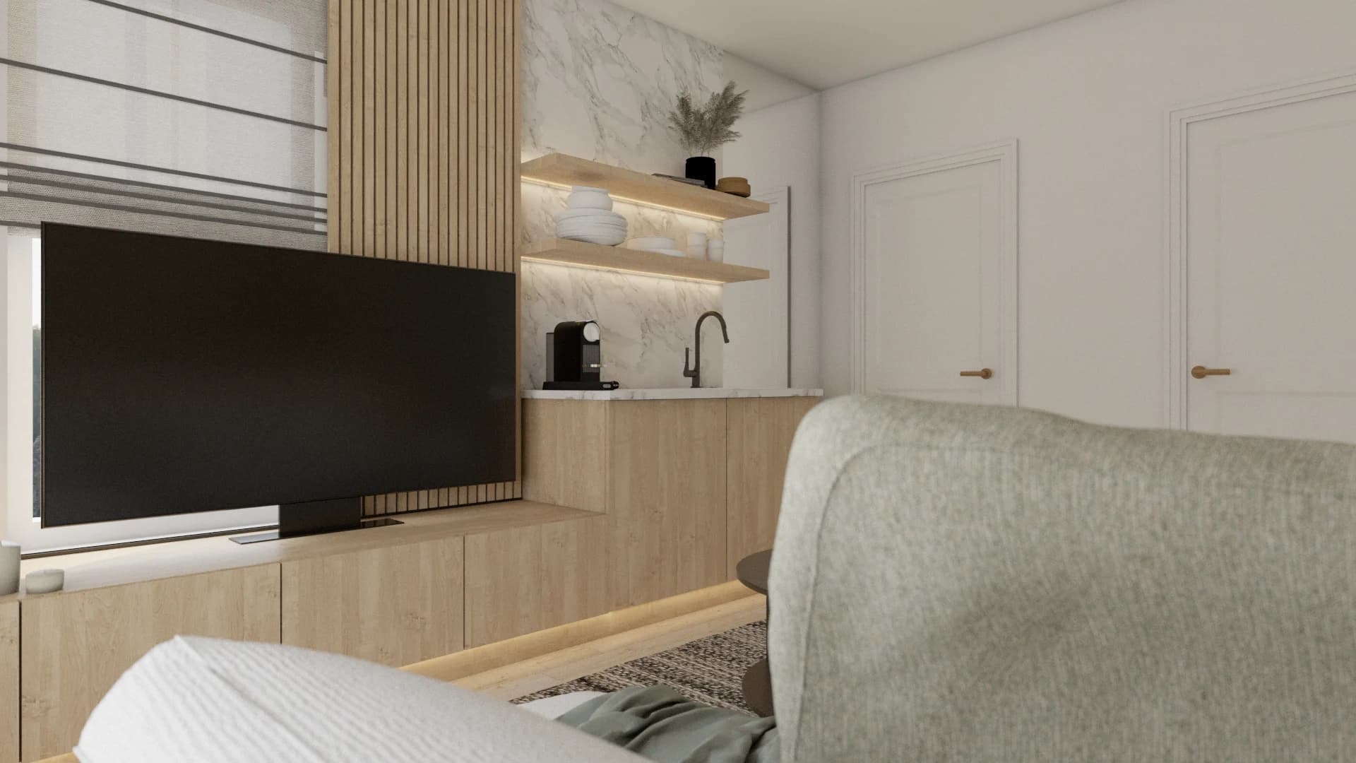 Close view of flat screen TV set into oak cabinet with marble bar and lit open shelf behind