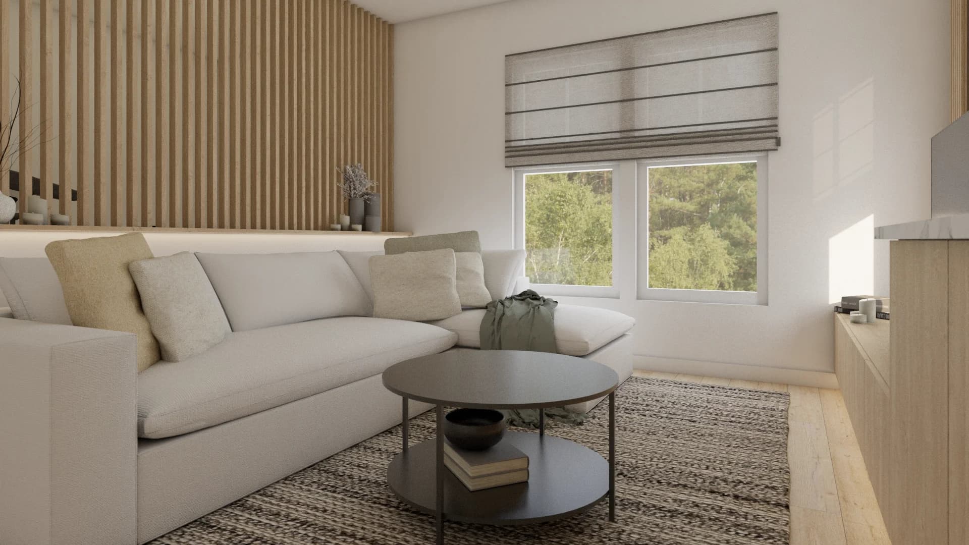 Cream sectional sofa and round black coffee table facing window with linen roman shade