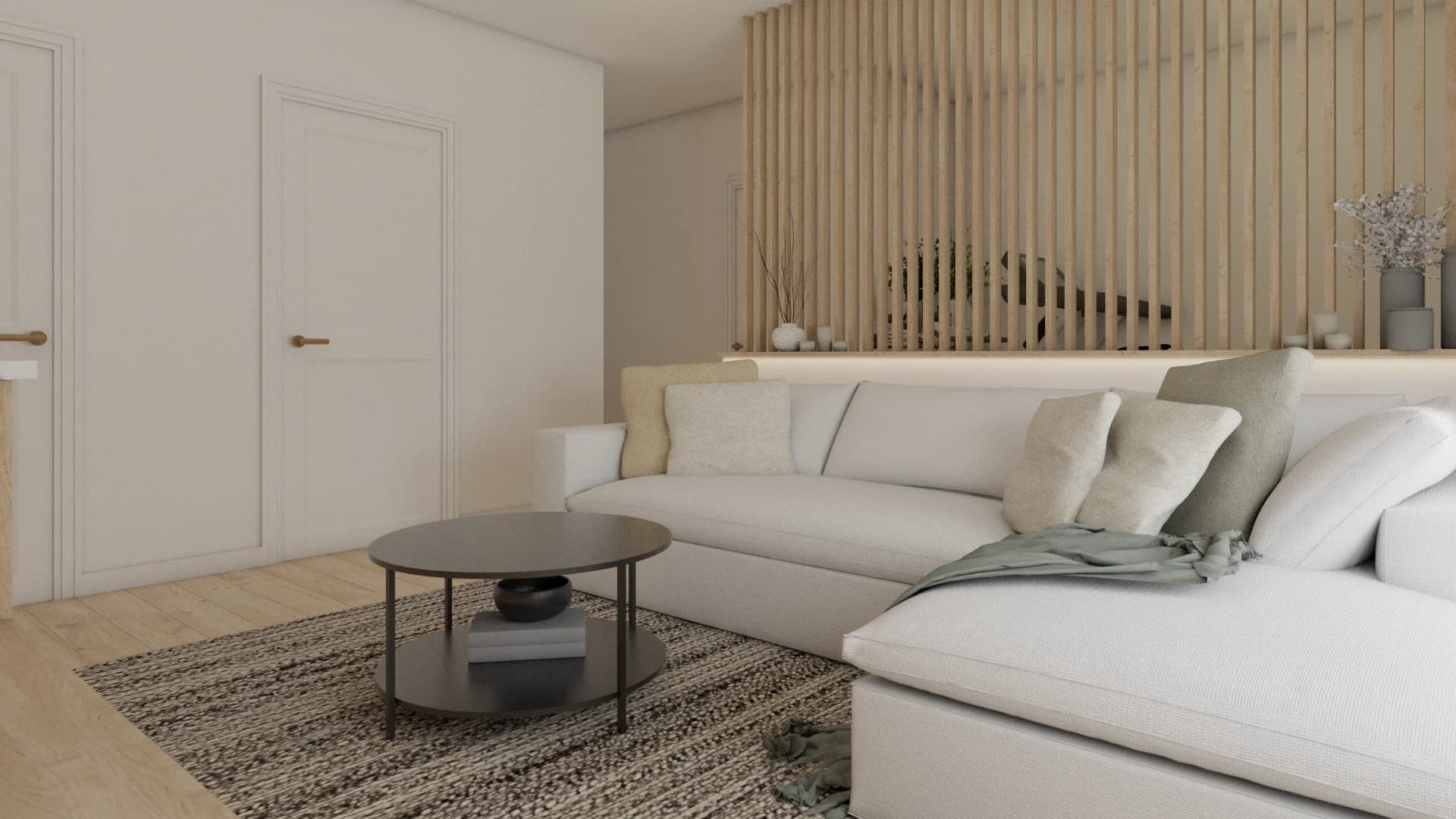 Wide living room view with cream sectional, round coffee table, wood slat wall, and white doors