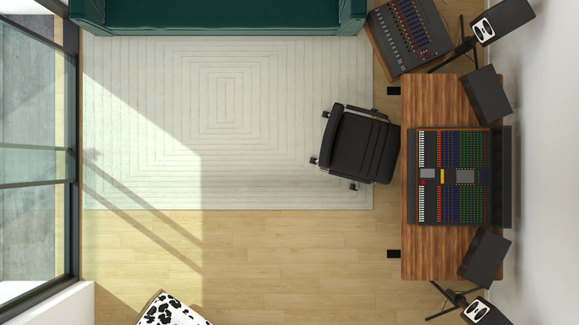 Bird's eye view of teal sofa, mixing desk, producer chair, and geometric rug in music studio