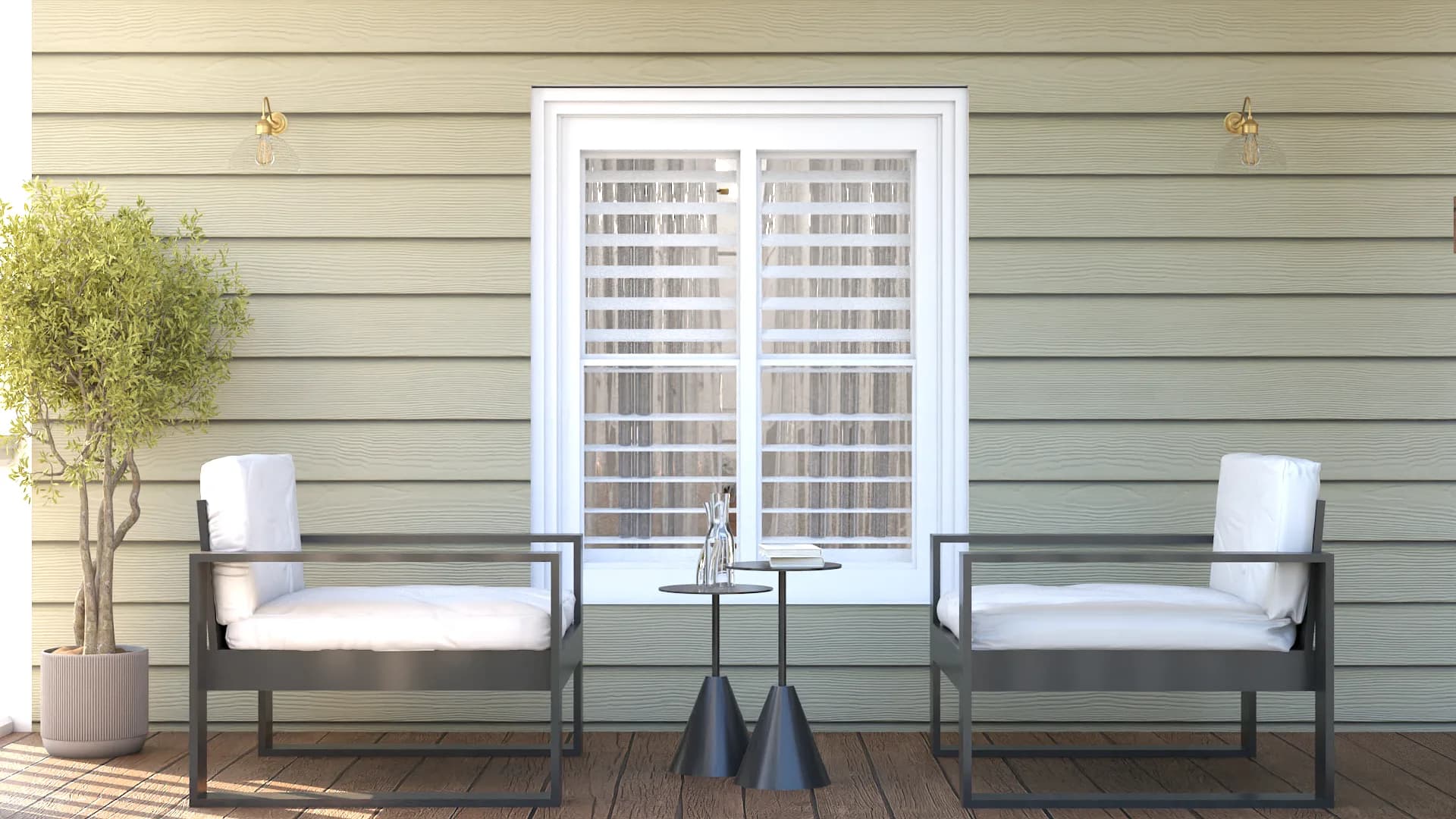 Metal armchairs on sage porch flanking French doors with brass sconces and olive tree planter