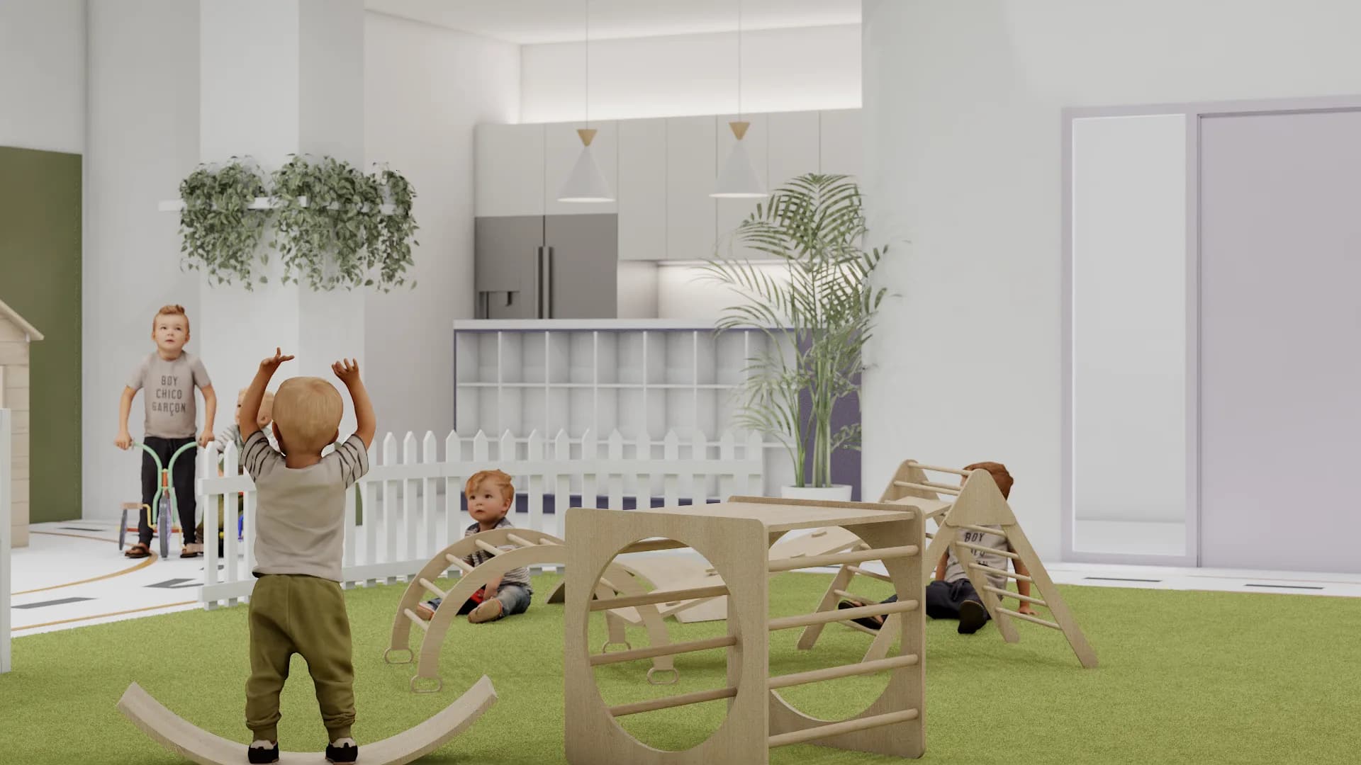 Commercial preschool playroom with green turf floor, Pikler triangle climbers, white picket fence dividers, and safari mural