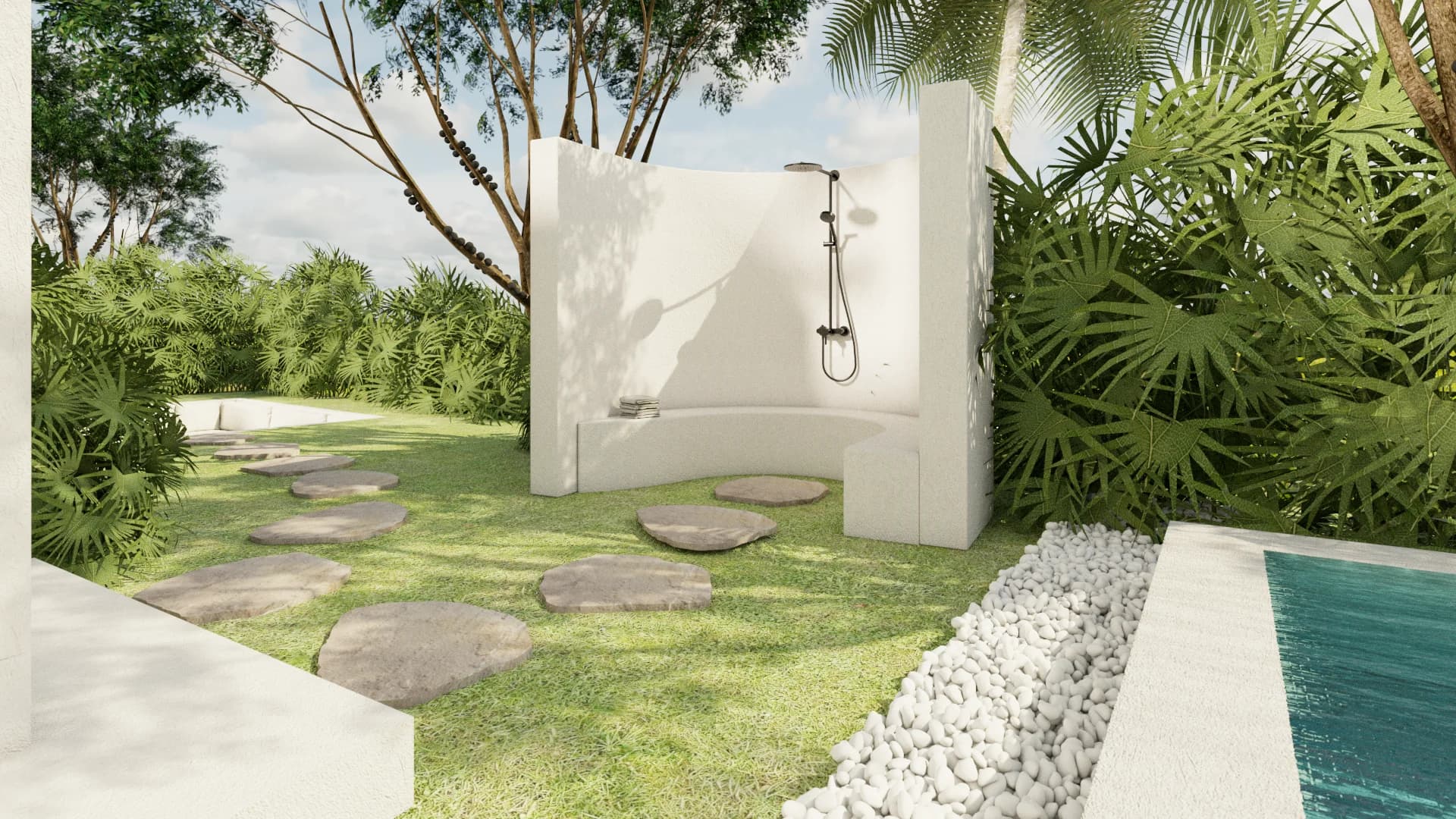 Outdoor shower with white stucco privacy wall, stepping stones, tropical hedging, and white river rock pool border