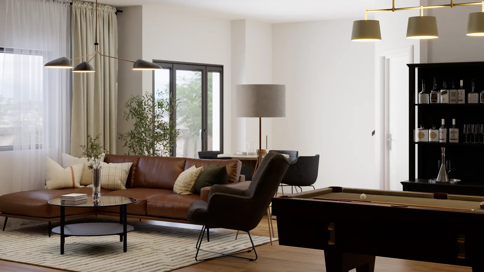 Cognac leather sectional and wingback chair beside dark bar cabinet with billiard table