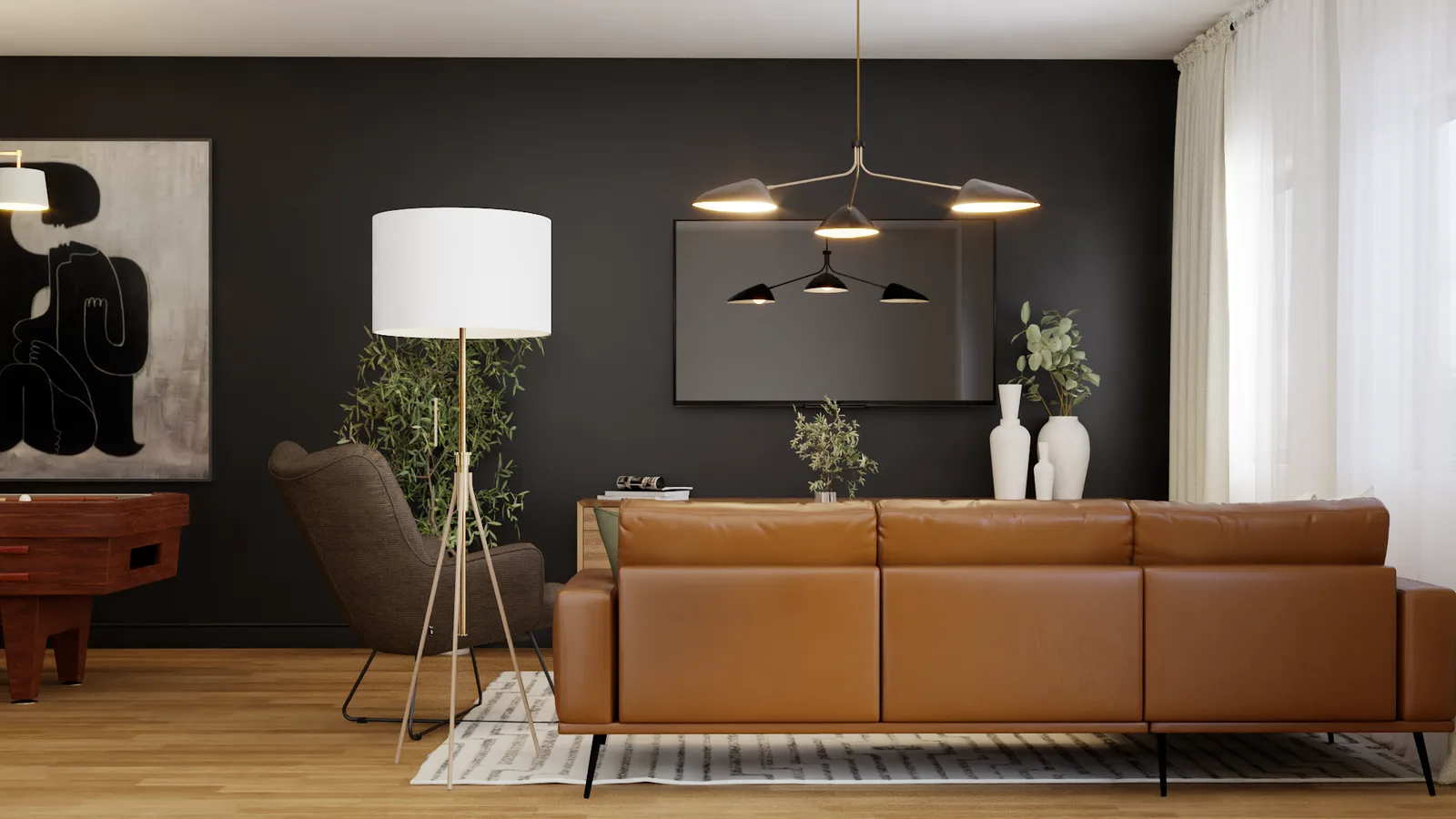 Cognac leather sofa against charcoal accent wall with brass tripod floor lamp and abstract art
