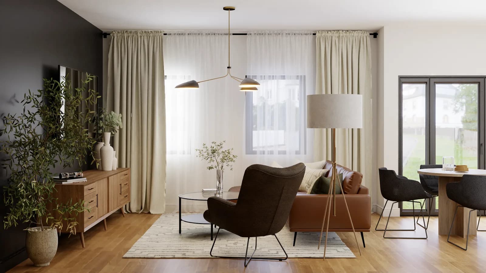 Cognac leather sofa and dark wingback chair with oak sideboard near garden glass doors