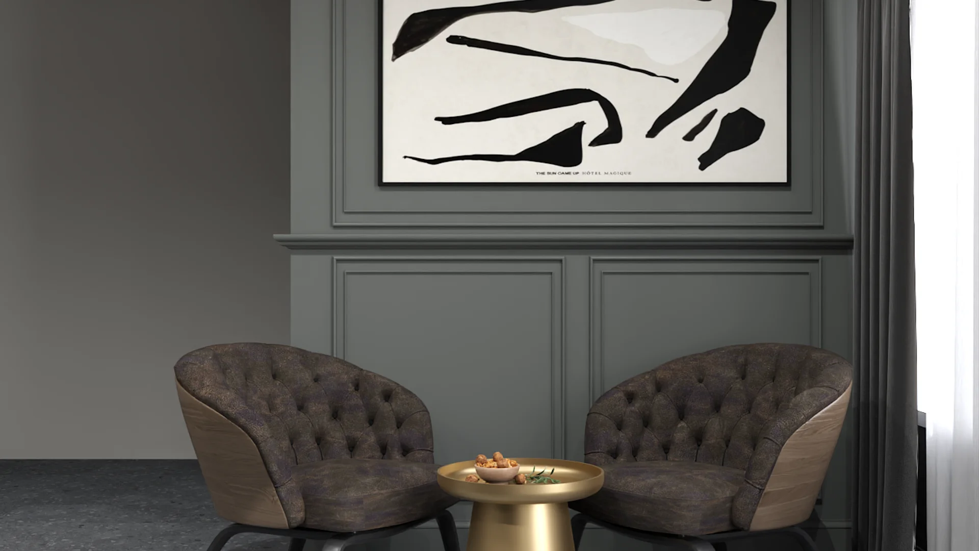 Two tufted brown armchairs with brass legs flanking a gold drum side table against gray wainscoting