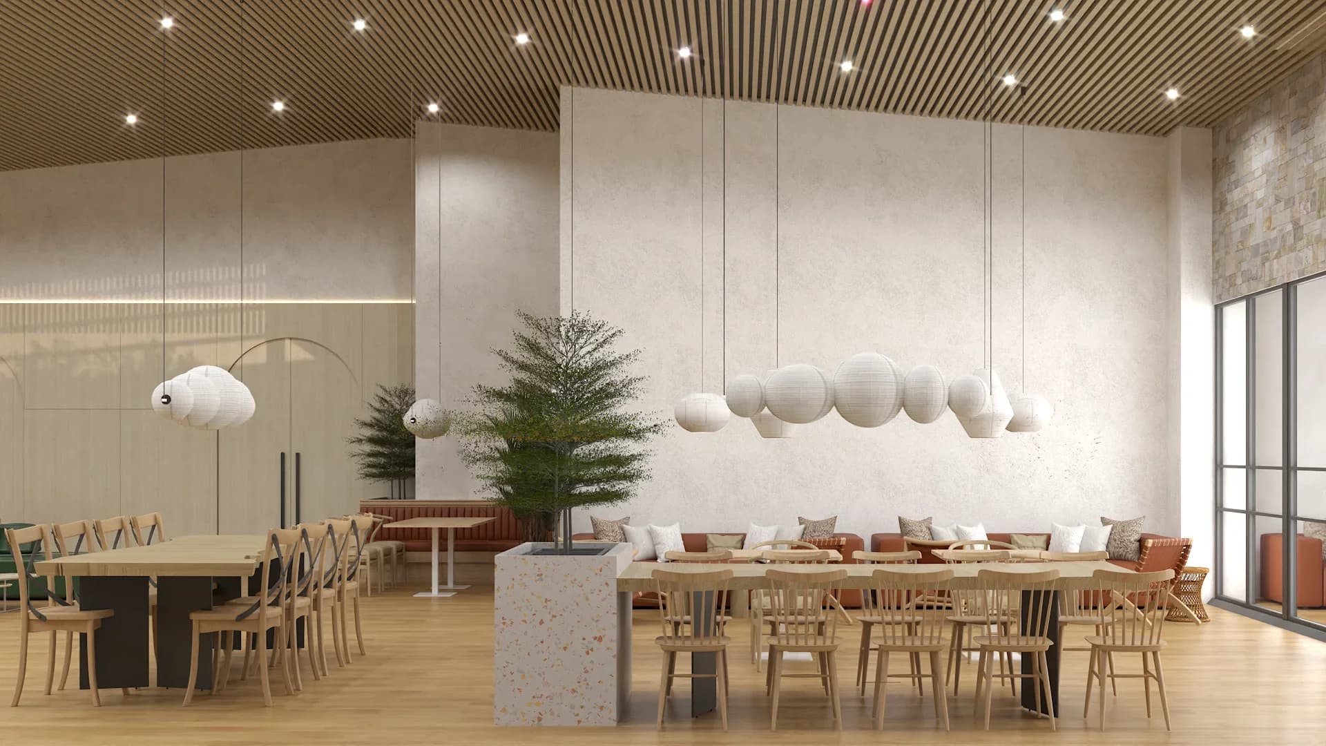 Main dining hall with slatted wood ceiling, white paper globe pendant cluster over a terrazzo-topped island counter, terracotta leather bench seating along the walls, light wood dining chairs, a decorative pine tree, and floor-to-ceiling windows with recessed LED strip lighting