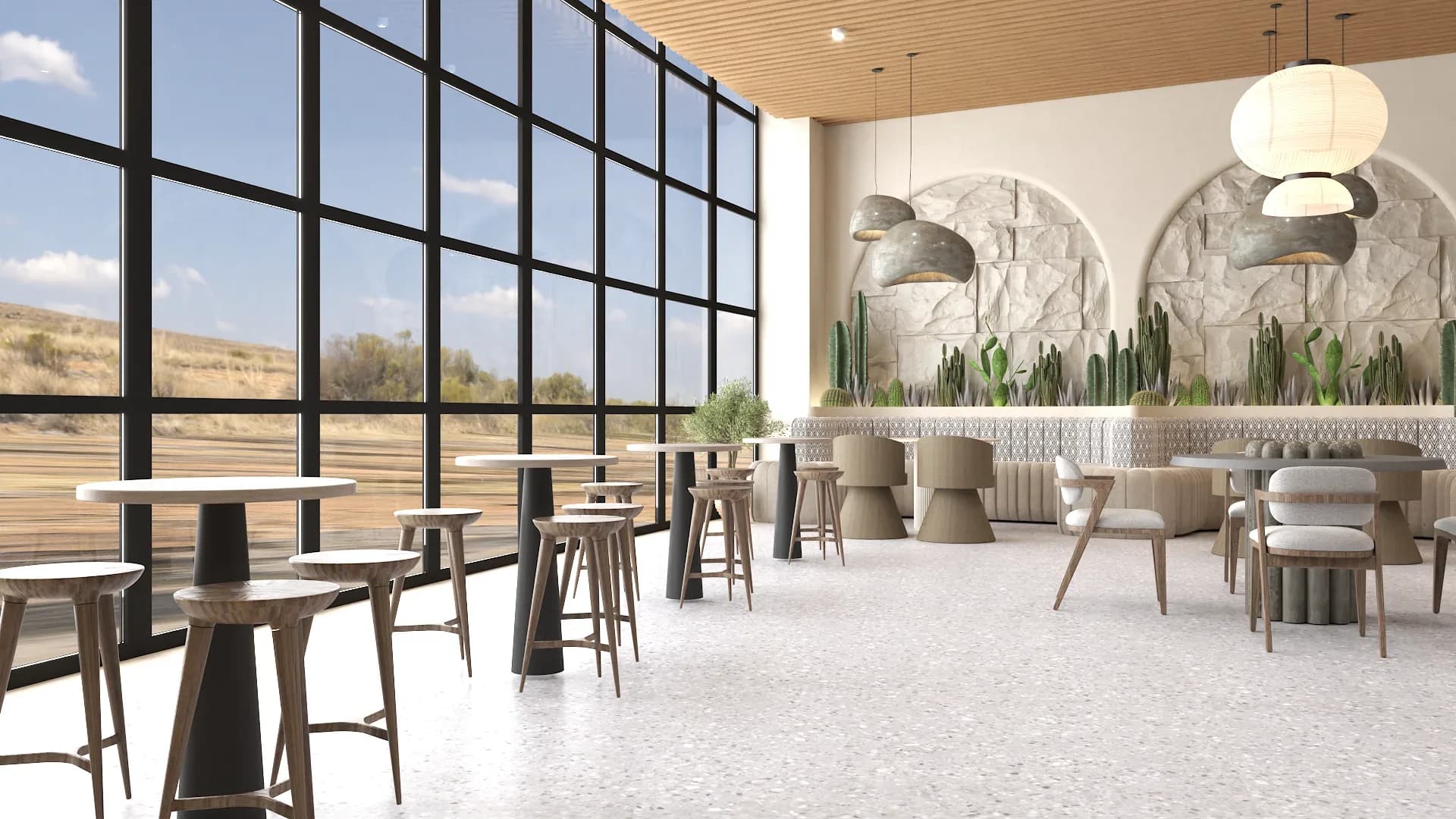 Desert restaurant with floor-to-ceiling black steel grid windows overlooking arid landscape, dark sculpted bistro tables with tall bar stools, two large stone arches filled with cactus plantings, paper lantern and gray dome pendant lights, terrazzo flooring, and natural wood slat ceiling