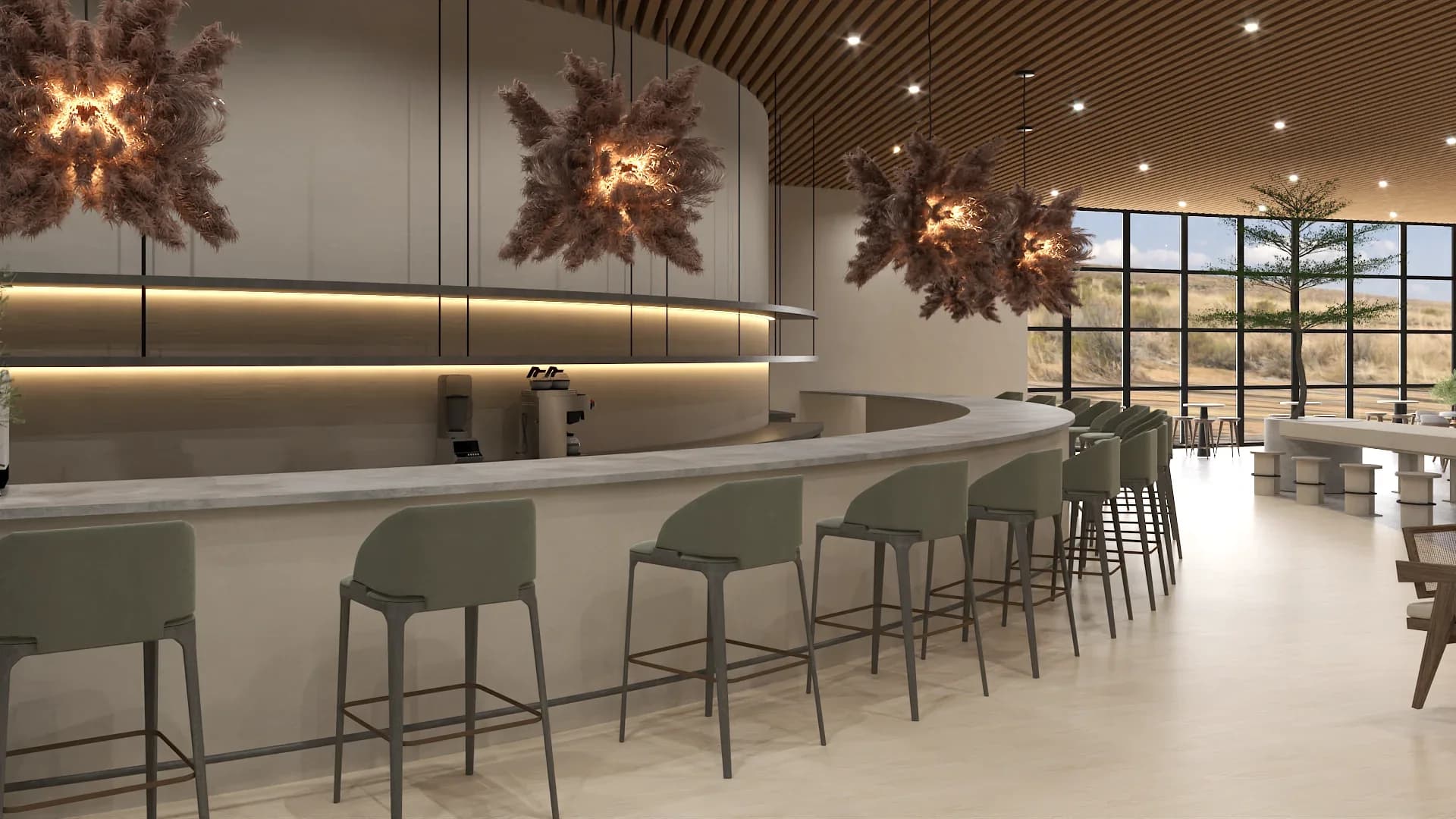 Curved bar counter with sage green upholstered bar stools, dark marble countertop with brass foot rail, three large dried pampas grass sculptural chandeliers with interior lighting, wood slat ceiling with recessed spotlights, back bar shelving, and floor-to-ceiling windows with desert landscape views