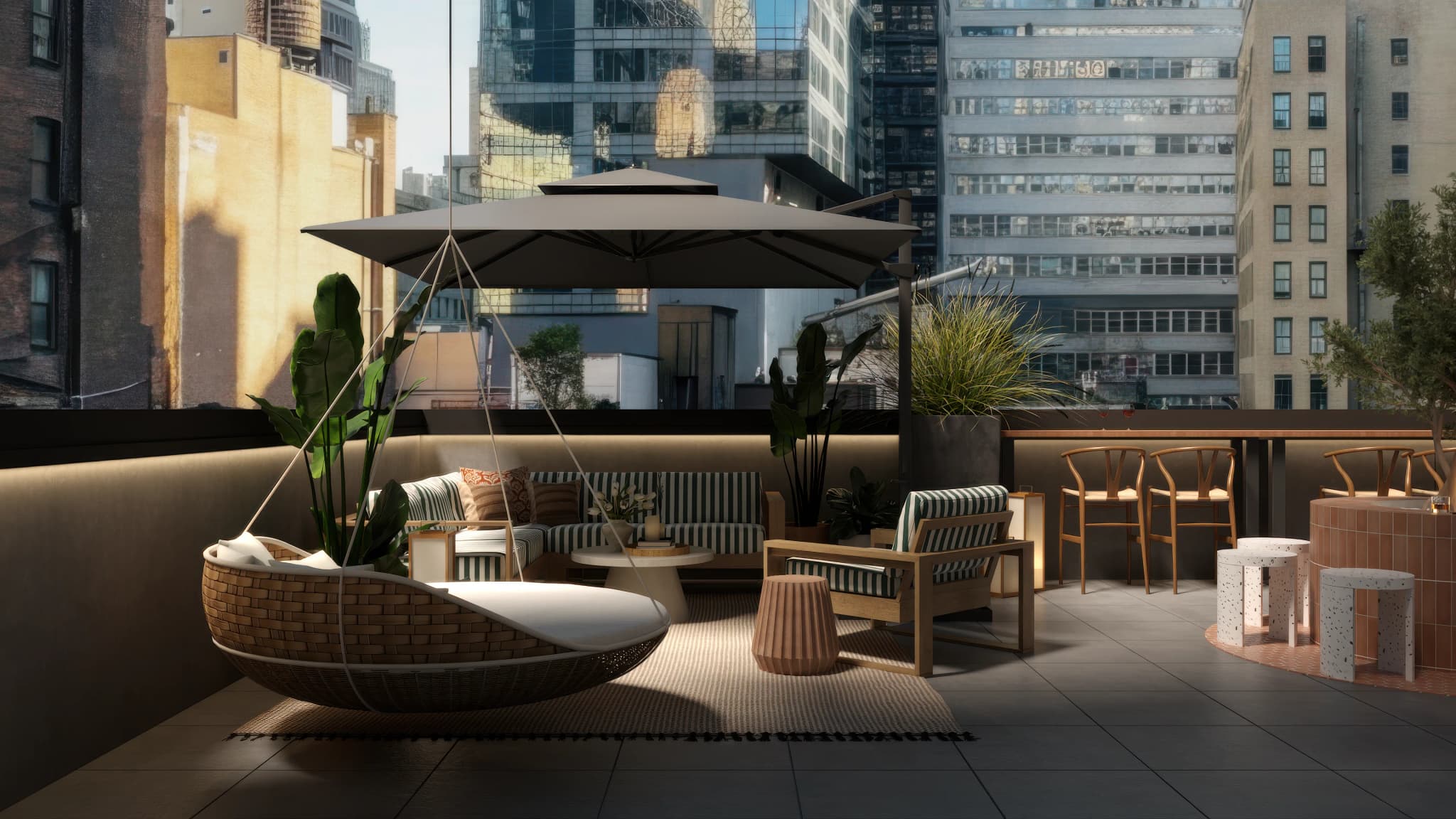 Boutique hotel rooftop terrace with hanging wicker daybed, green striped outdoor furniture, cantilever umbrella, and Manhattan skyline. Design by Debora Interiors.