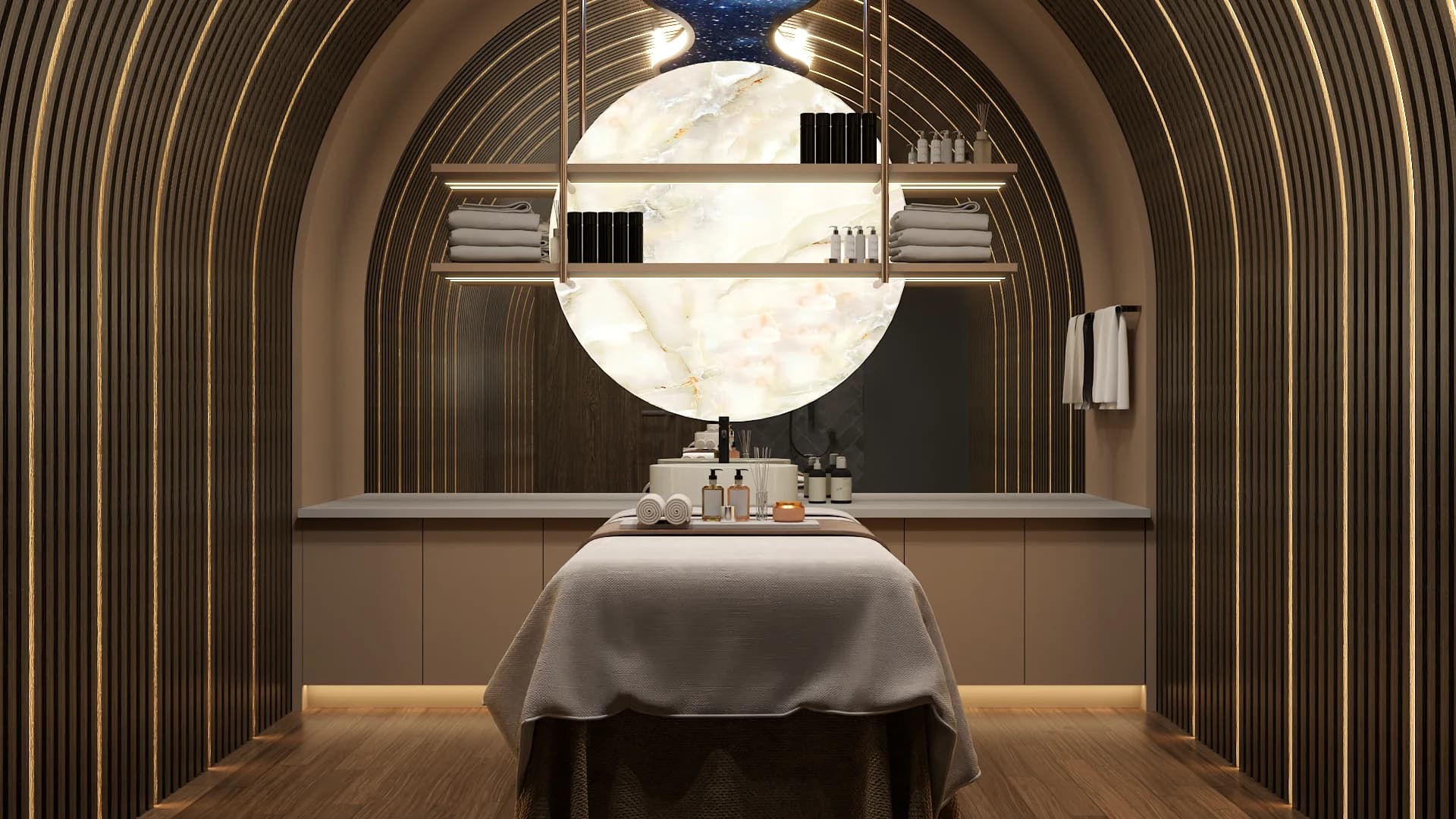 Spa treatment room with concentric brass arches, backlit circular marble disc, and massage table on warm oak floor