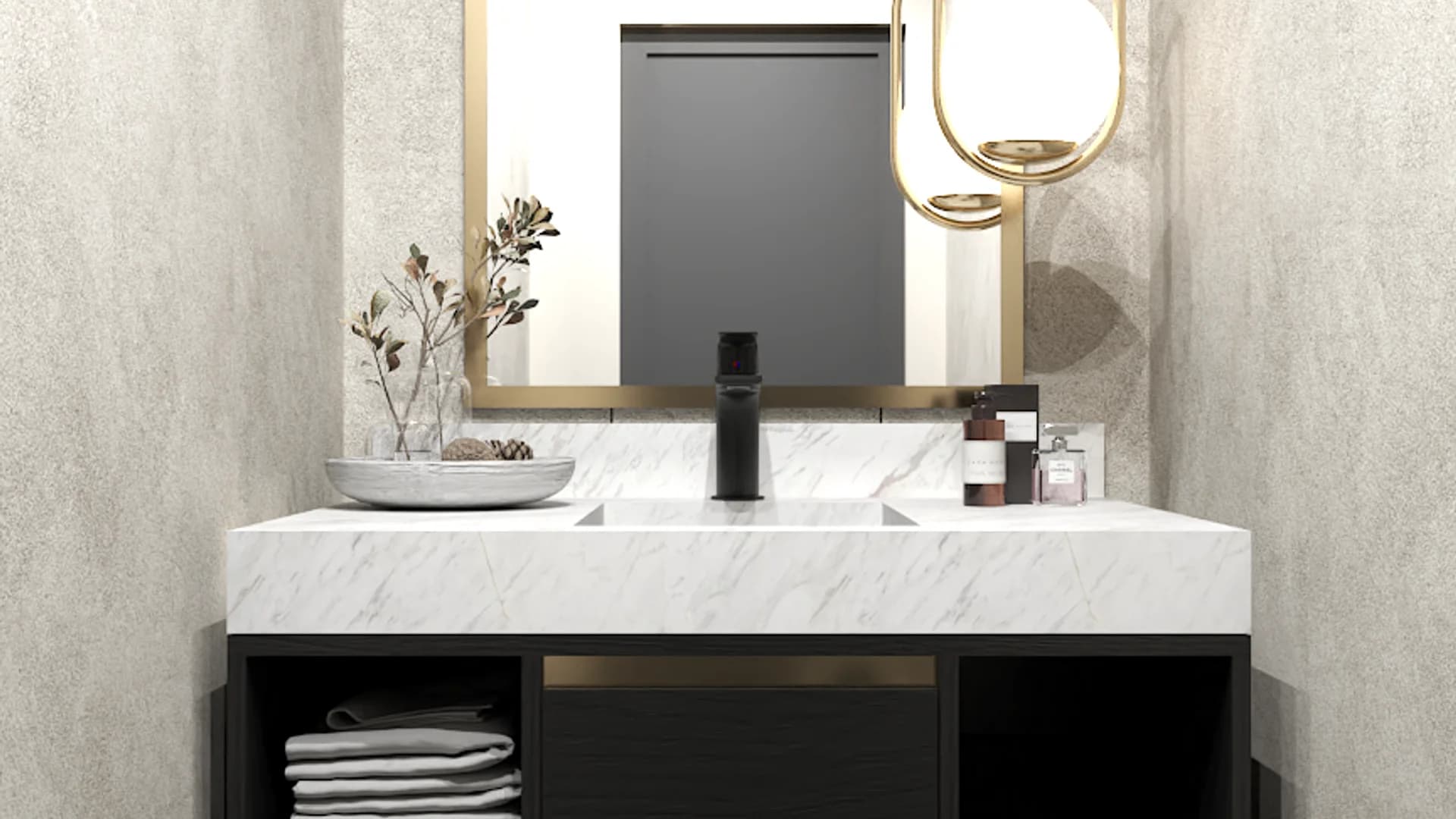 Vanity closeup with white marble countertop, gold-framed mirror, matte black faucet, and open towel cubbies below