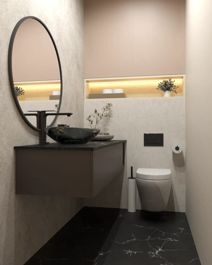Powder room with oval mirror, black vanity, lit niche, and black marble floor