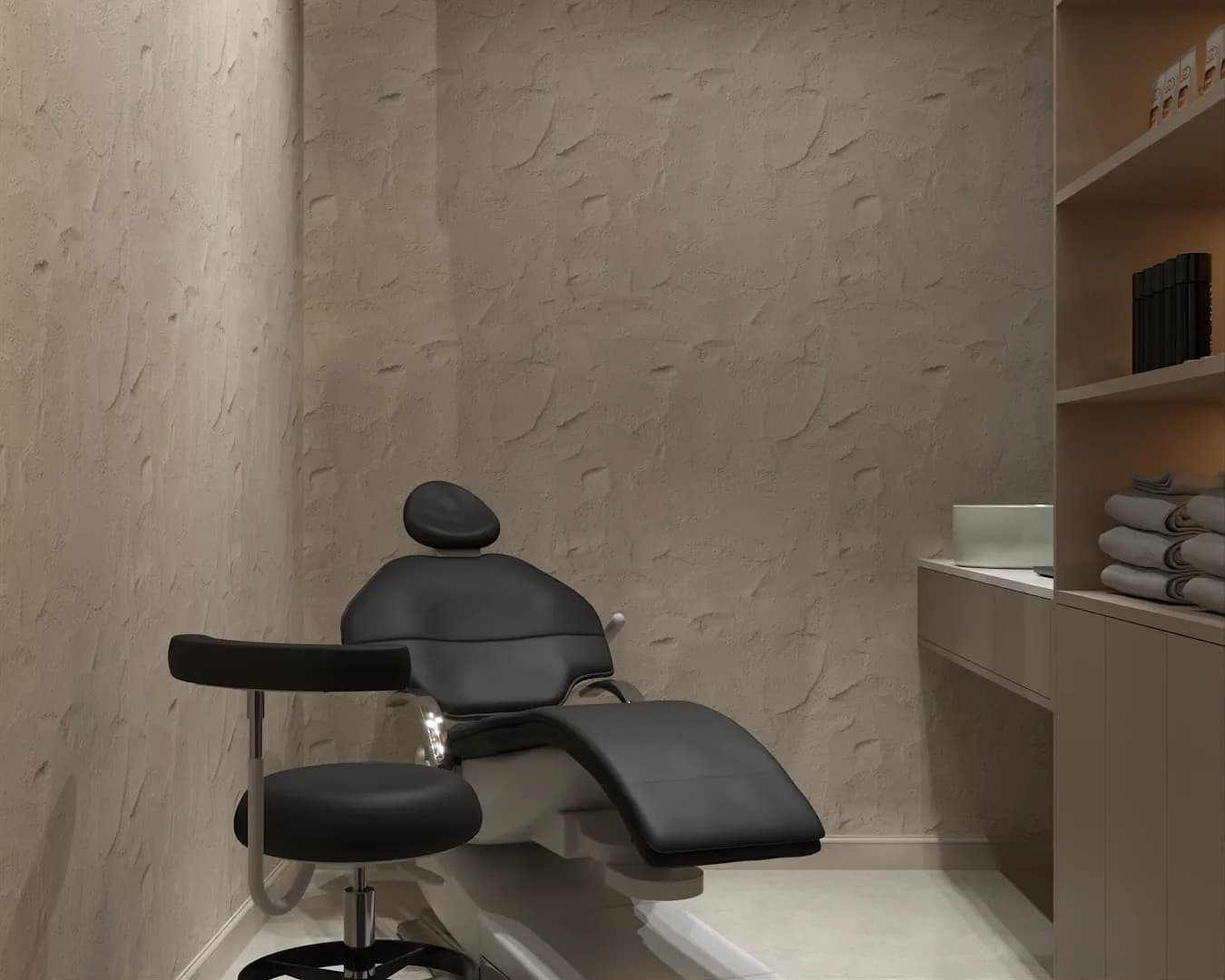 Treatment chair close-up against textured plaster wall with product shelving