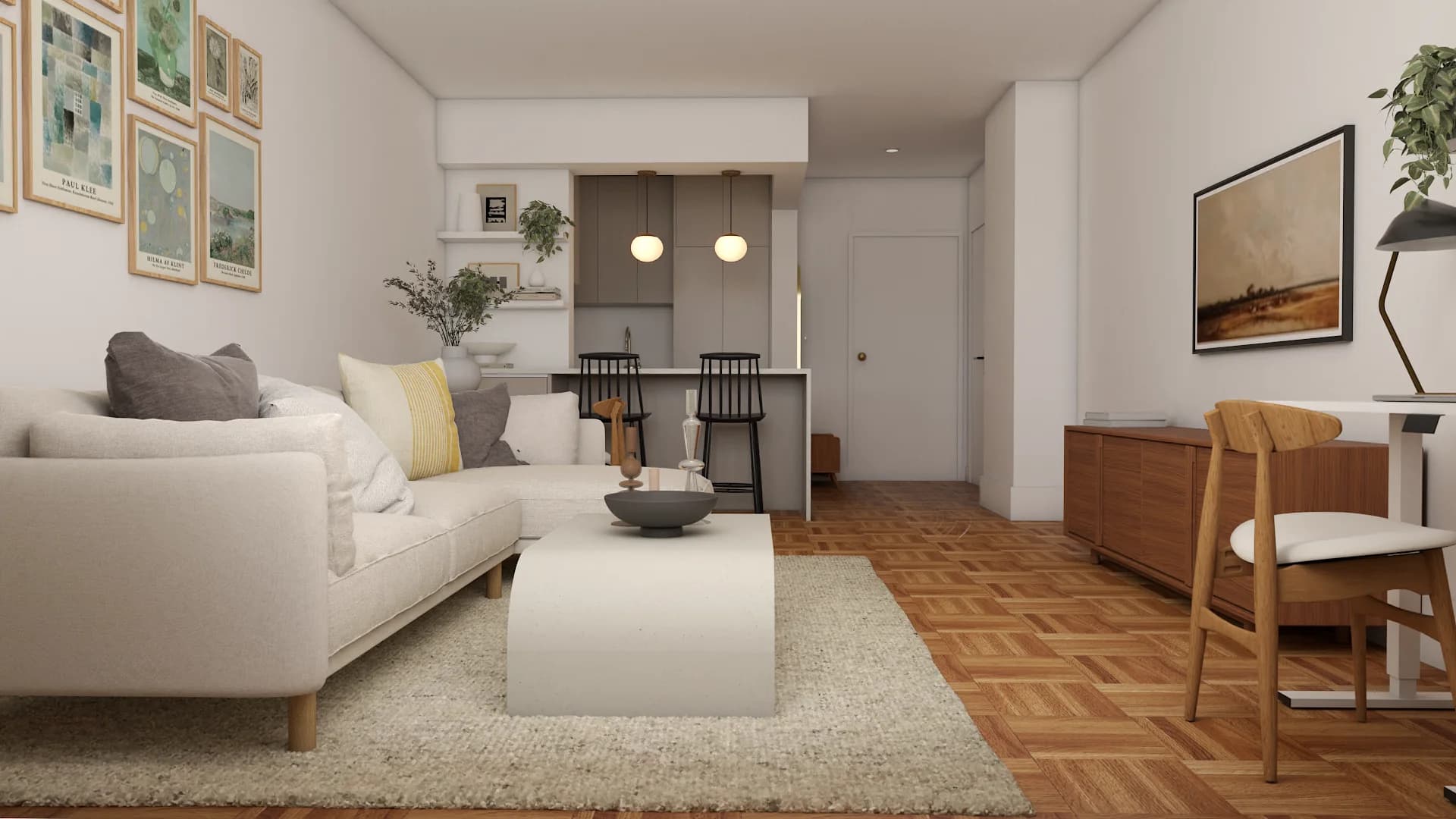 Diagonal view across studio living room toward kitchen island and pendant lights