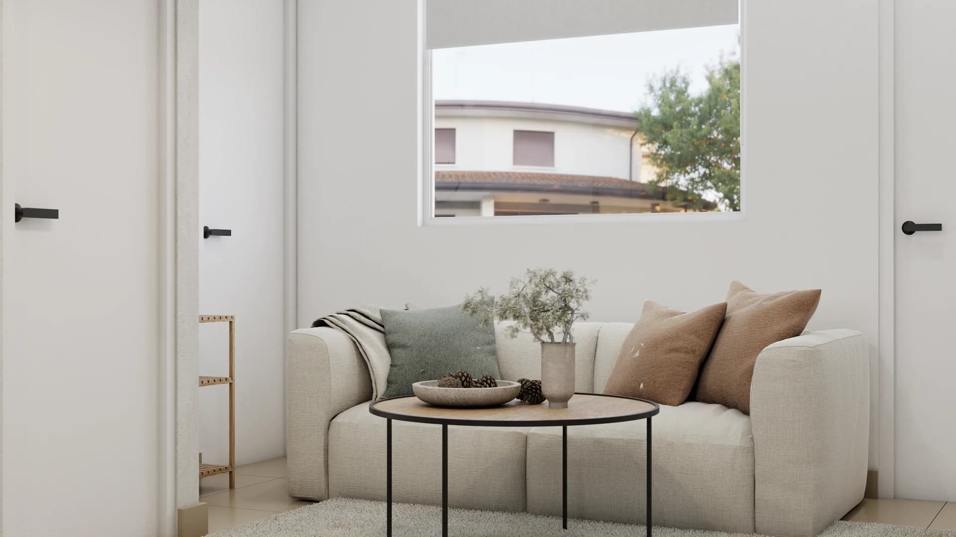 Cream bouclé sofa with sage and terracotta cushions, round wood coffee table, and bright window above