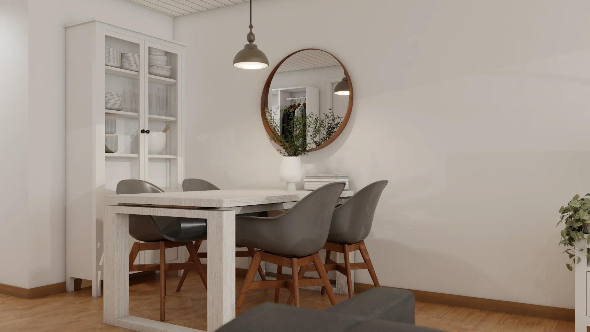 Studio dining zone with white parsons table, gray shell chairs, walnut mirror, and glass-front hutch