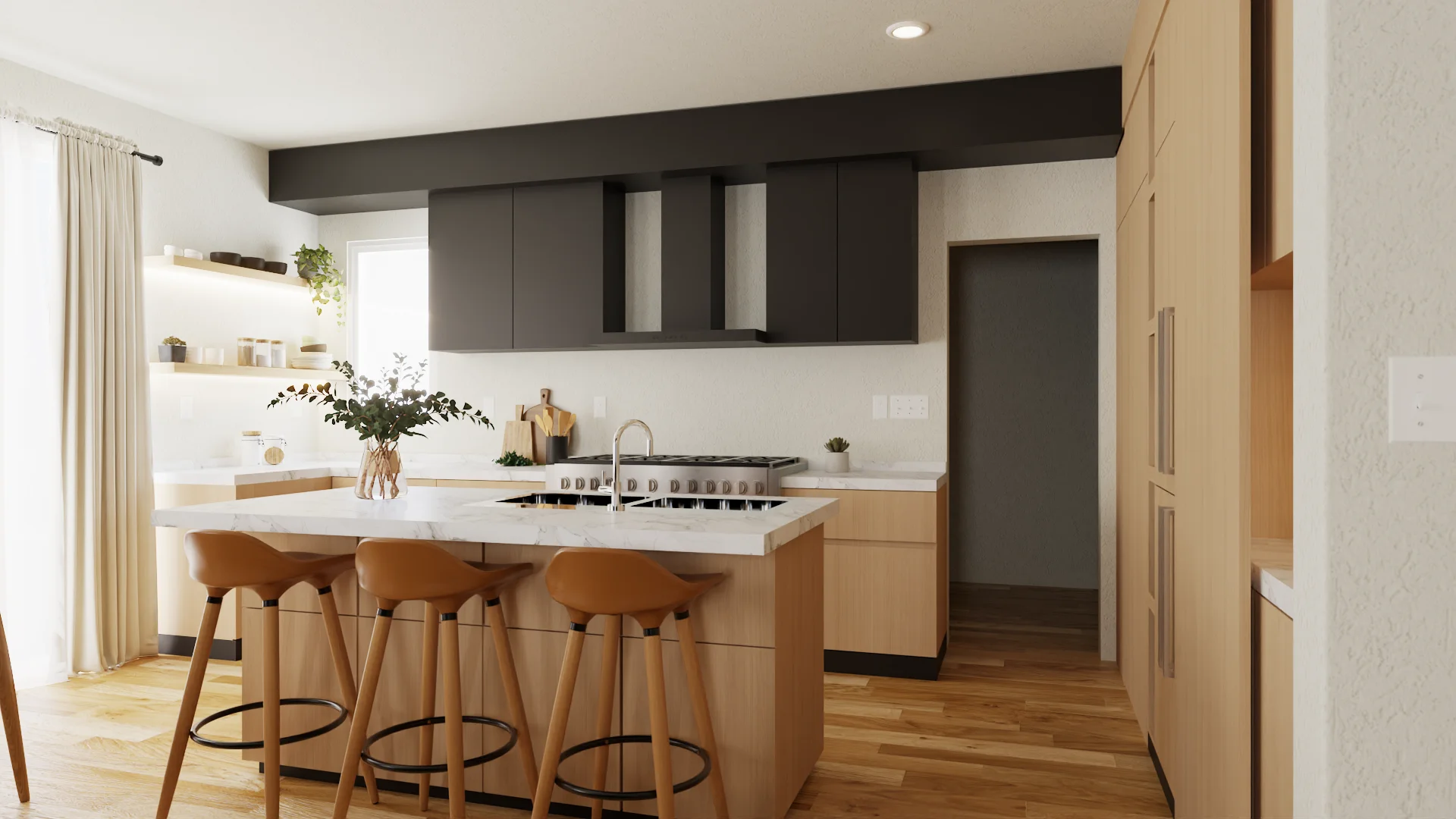 Kitchen island with marble waterfall, brass faucet, three cognac leather counter stools, and oak base