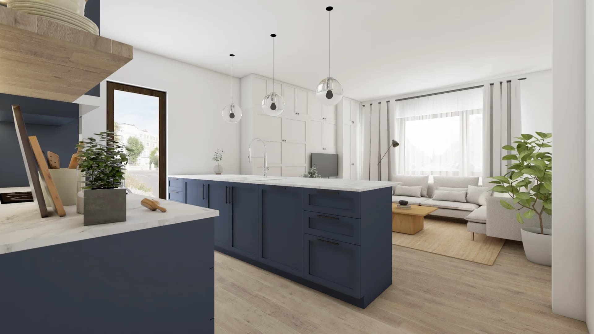 Navy kitchen island with globe pendants opening to cream sectional living area