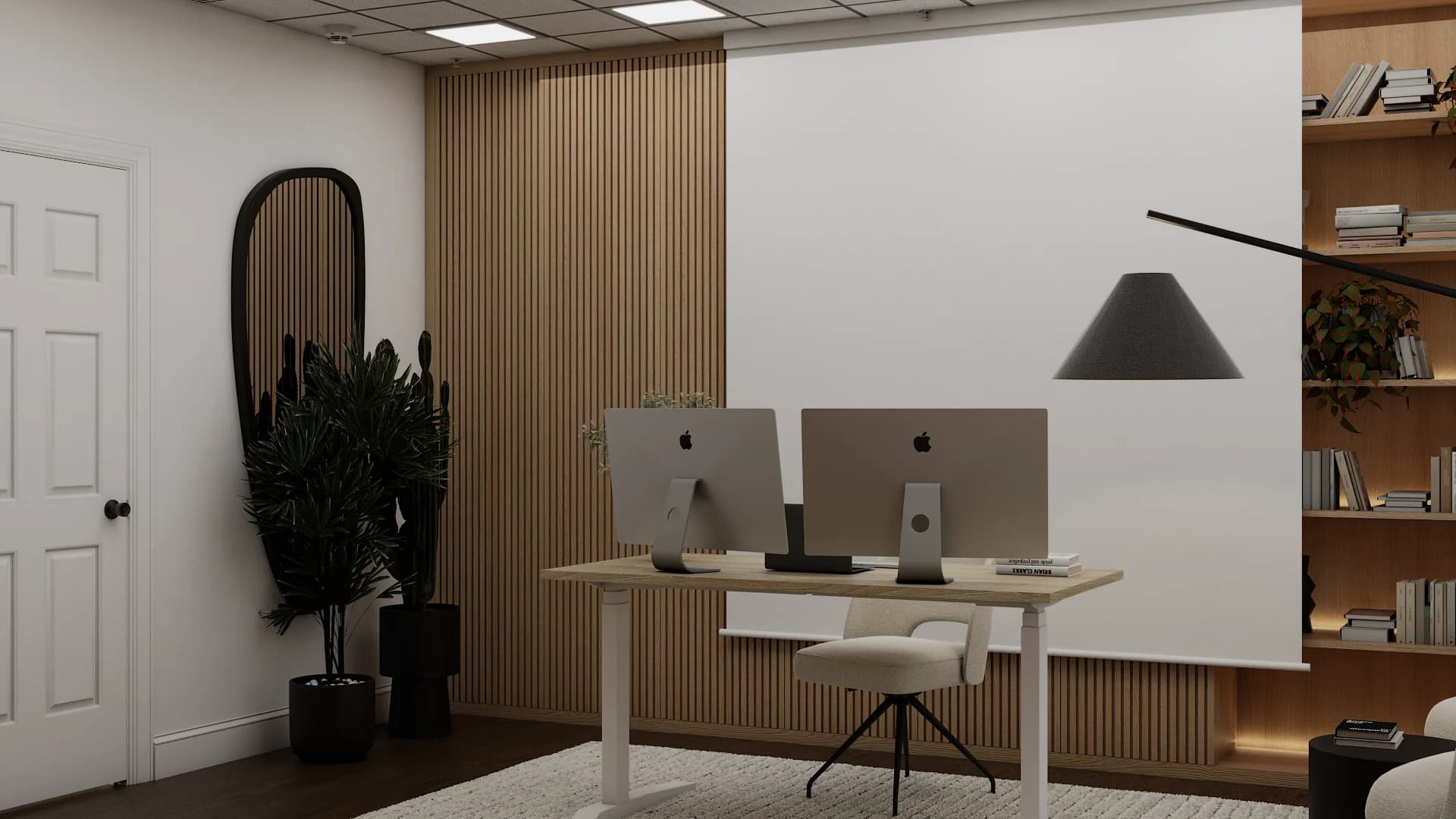 Studio entry with arched black mirror, wood slat accent wall, dual monitor desk, and open bookcase