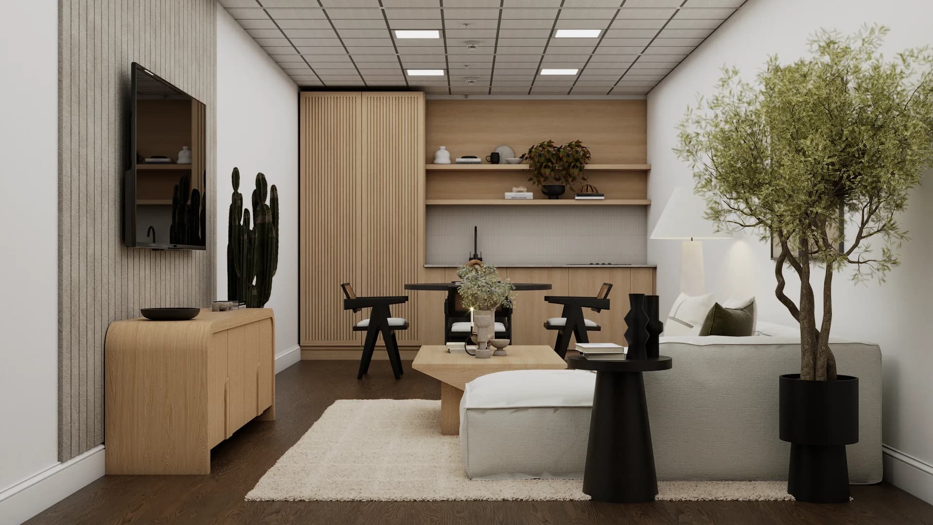 TV on vertical wood slat wall above oak credenza with tall cactus, sectional and olive tree beyond