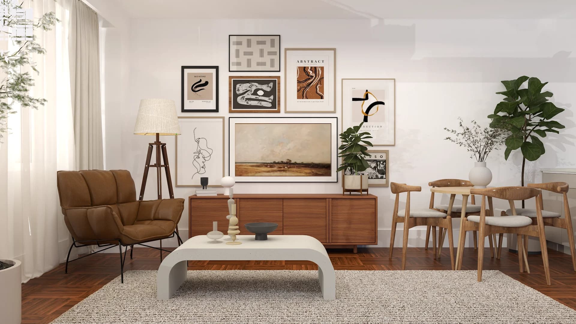 Walnut credenza with gallery wall of abstract prints, leather armchair, and round dining table in open studio