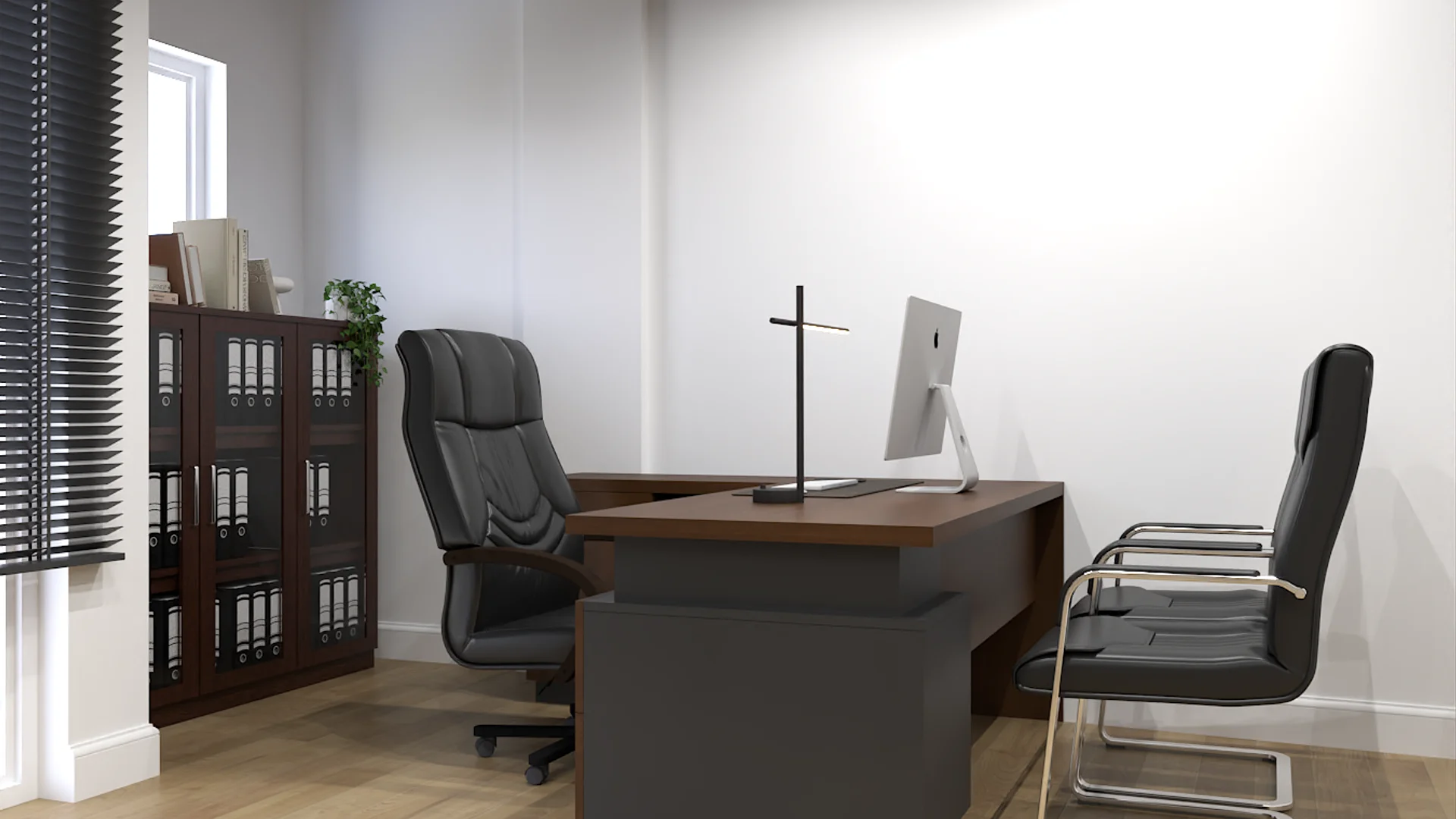 Dark walnut L-shaped desk with black leather executive chair, bookcase with binders, and iMac monitor