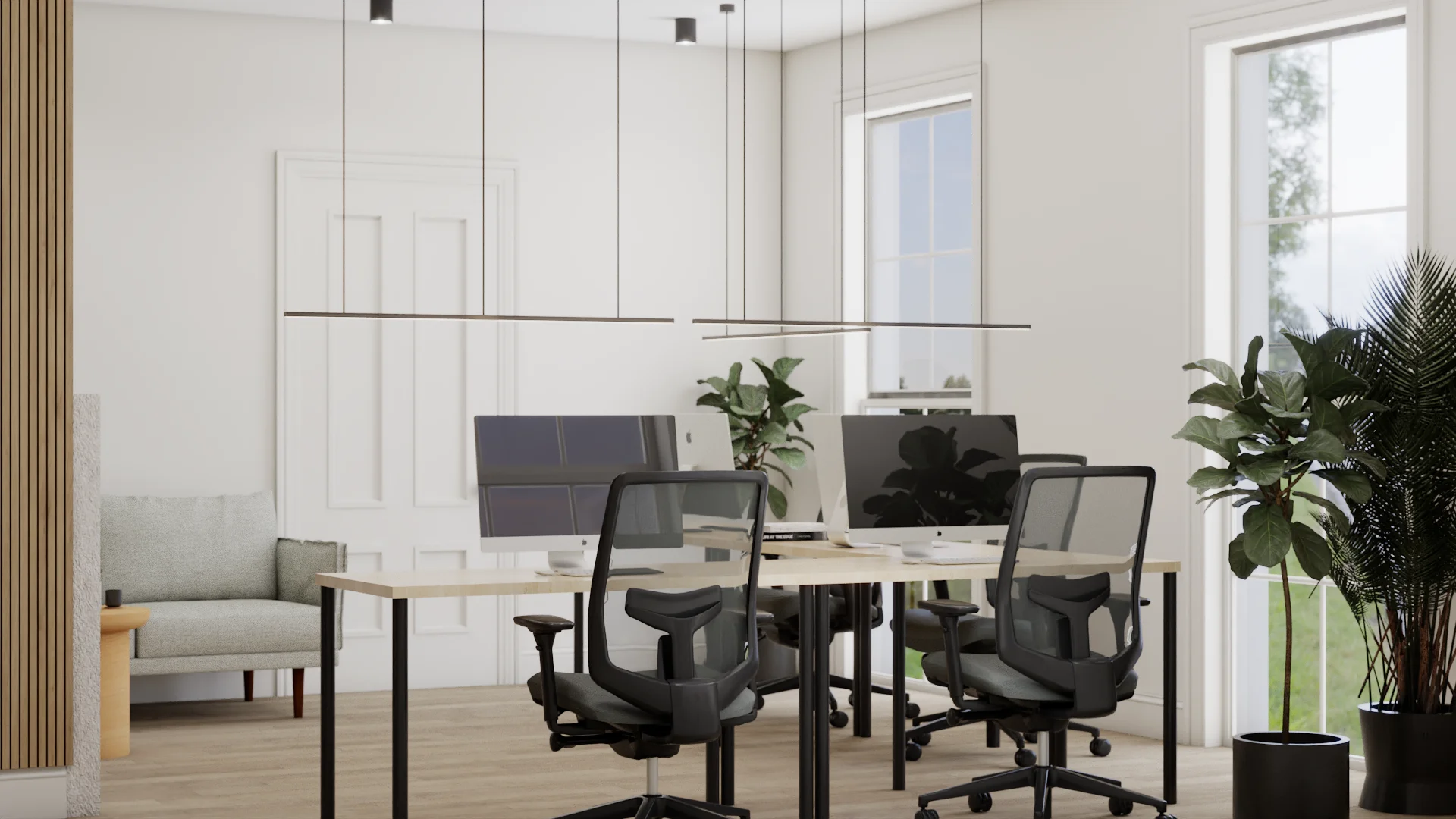 Four-desk open office with maple bench desks and black steel frames, black mesh ergonomic chairs, dual monitors, two staggered linear pendant lights, white paneled walls, tall grid windows with garden view, light gray lounge chair at left