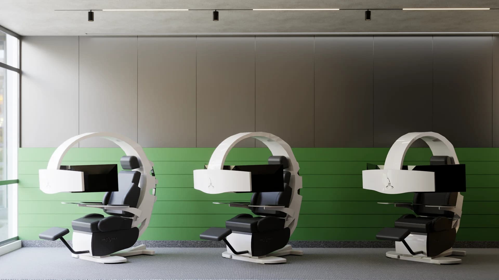 Three white pod workstations with black chairs, green accent wall band, gray panels, and track lighting