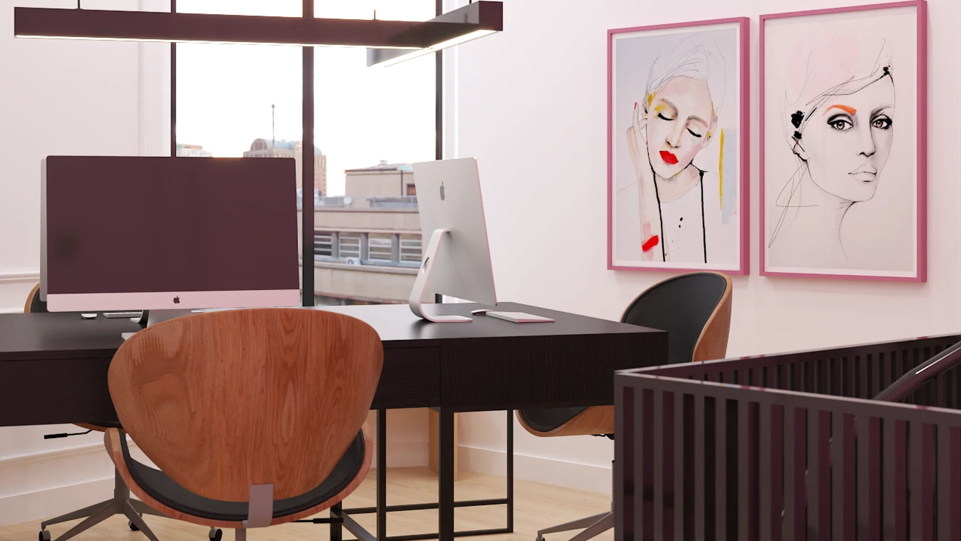 Mezzanine dual desks with iMacs, walnut chairs, and pink-framed fashion portraits