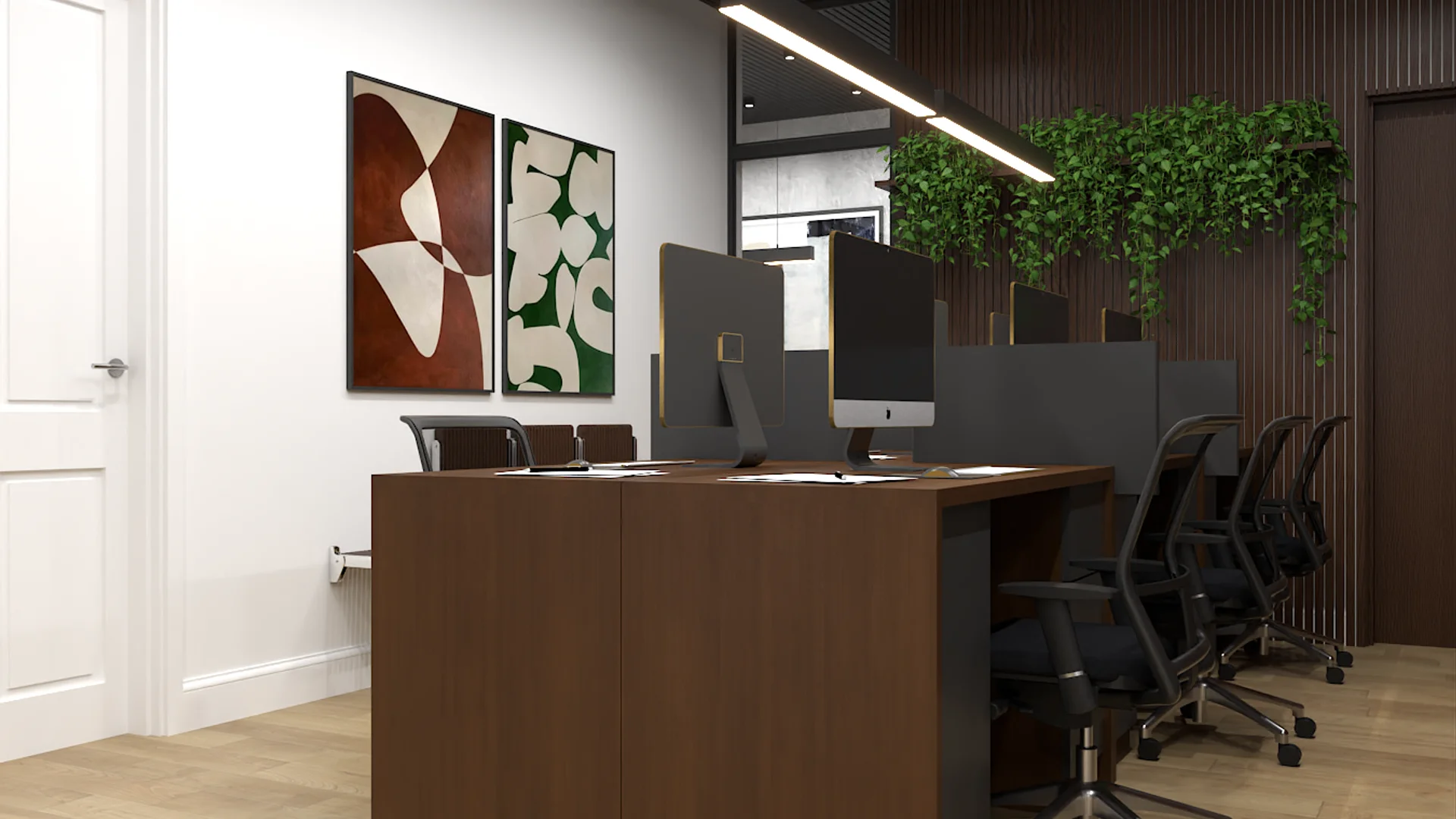 Six-desk walnut island workstation with geometric botanical wall art and trailing greenery