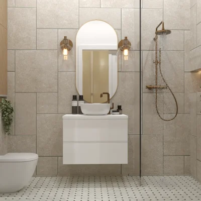 Contemporary bathroom with industrial style elements including exposed gold fixtures and textured tiles, paired with a sleek white vanity and a classic oval mirror, creating a stylish and sophisticated space. Design by Debora, an online interior design service.