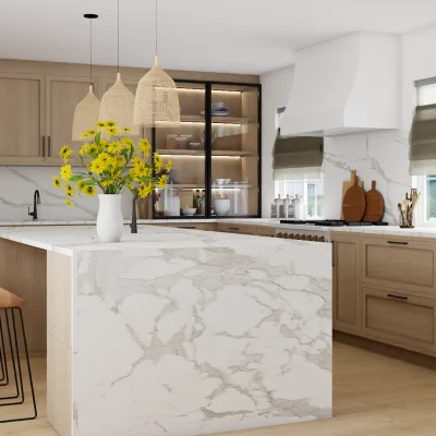 Bright and airy kitchen with marble islands and floral accents, blending classic charm with modern design. Design by Debora, an online interior design service based in New York City.