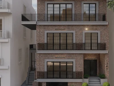 An urban brick building with multiple balconies and modern black-framed windows, perfect for sophisticated city living. The design merges classic architecture with contemporary elements. Design by Debora, an online interior design service.