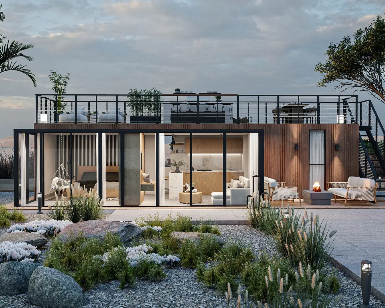 A modern container home with a spacious rooftop terrace, large windows, and contemporary design elements. The exterior is beautifully landscaped with a variety of plants and rocks, creating an inviting outdoor space. Design by Debora, an online interior design service.