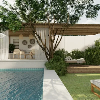 A tranquil outdoor living area featuring a pool and shaded seating. The design creates a relaxing retreat that blends seamlessly with the surrounding nature. Design by Debora, an online interior design service.