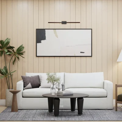 Minimalist living room with sleek white sofa and abstract artwork, set against a wooden panel backdrop. Interior design by Debora, enhancing spaces with art.